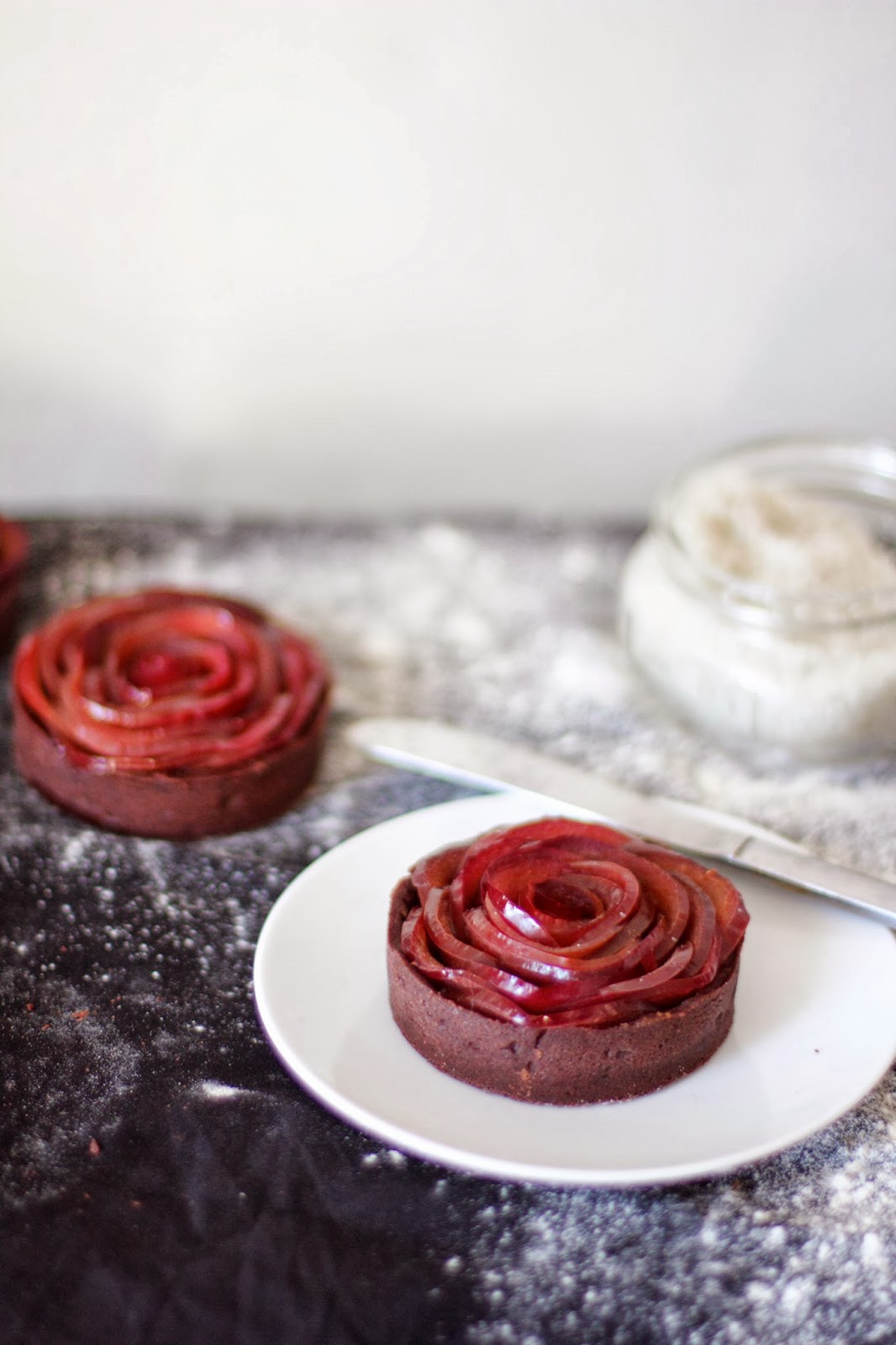 engrained mulled wine plum rose tarts with dark chocolate ganache