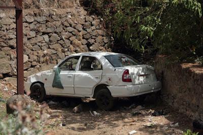"The tourist car which overshot landed in the stream below."