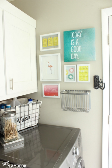 Gallery wall in an organized laundry room
