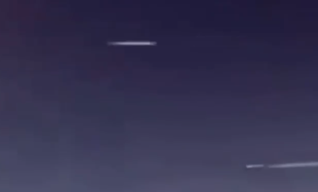UFO and a Jet seen from a passenger plane and filmed.
