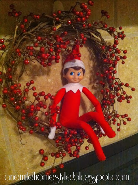 Elf on the Shelf hanging out on the wreath