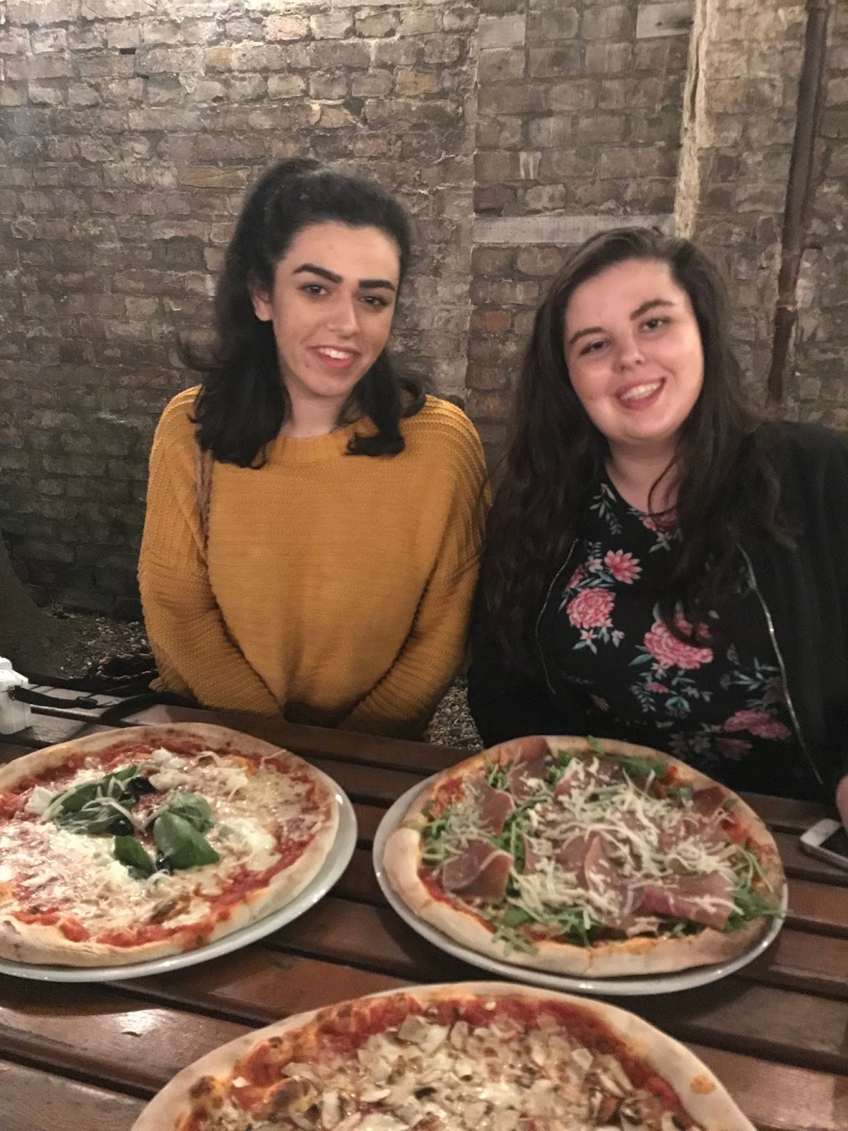 two girls at pizza restaurant