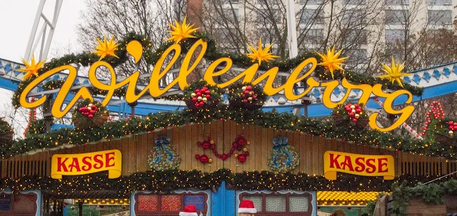 Colorful sign at the entrance to the Ferris wheel at the Christmas market in Berlin, Germany