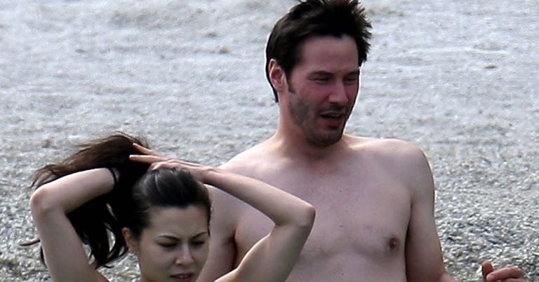 Keanu Reeves and his ex girlfriend China Chow topless swimming in Cannes.