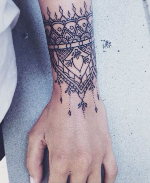 Wrist cuff tattoo