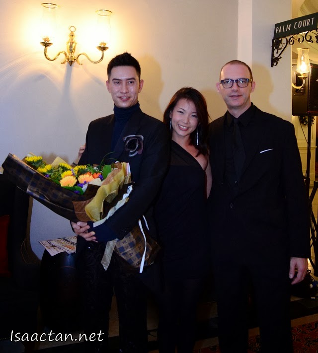 Brandon Tan, creative director of Bran et Daguet posing with guests of the 'Secret Rendezvous' Fashion Show