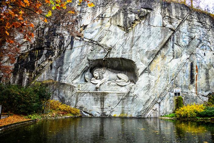 The Lion Monument, or the Lion of Lucerne, is a sculpture in Lucerne, Switzerland, designed by Bertel Thorvaldsen and hewn in 1820–21 by Lukas Ahorn. It commemorates the Swiss Guards who were massacred in 1792 during the French Revolution, when revolutionaries stormed the Tuileries Palace in Paris, France. Mark Twain praised the sculpture of a mortally-wounded lion as "the most mournful and moving piece of stone in the world."