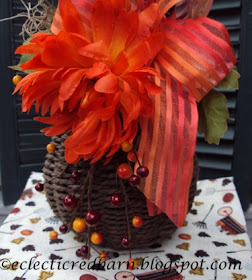 Eclectic Red Barn: Berries, mum, and ribbon attached to wicker vase