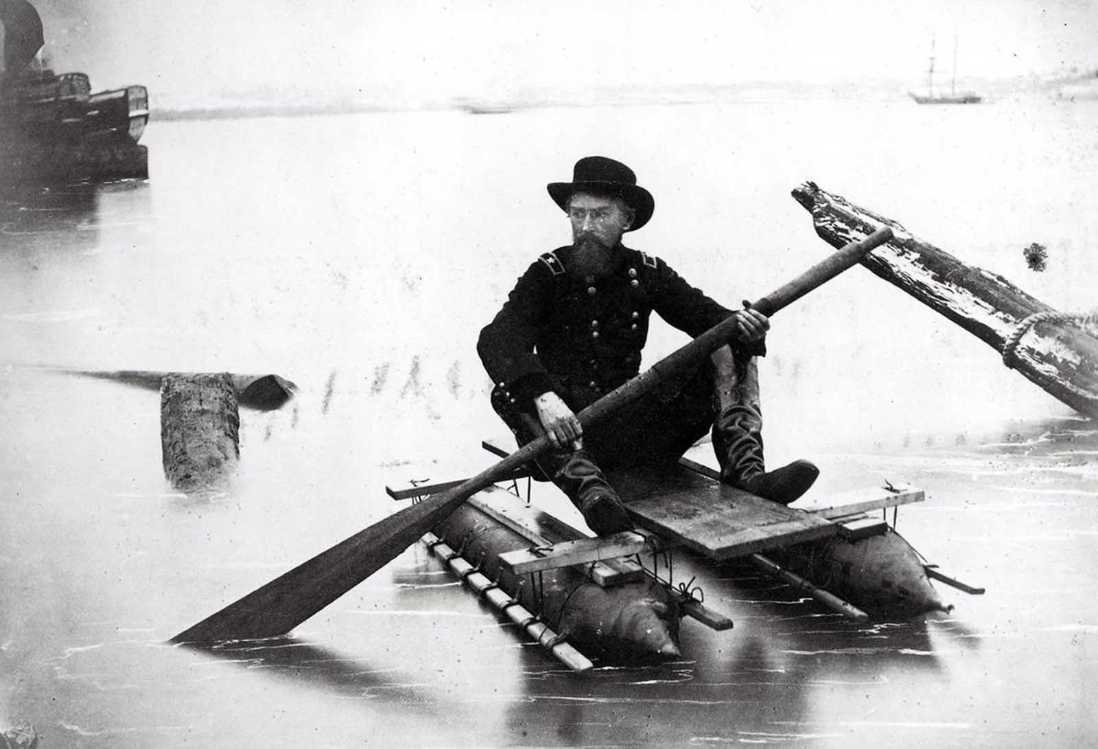 Union General Herman Haupt, a civil engineer, moves across the Potomac River in a one-man pontoon boat that he invented for scouting and bridge inspection in an image taken between 1860 and 1865. Haupt, an 1835 graduate of West Point, was chief of construction and transportation of U.S. military railroads during the war.