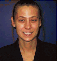 A passport-photo style picture of a smiling young white woman with her light-brown hair pulled back from her face