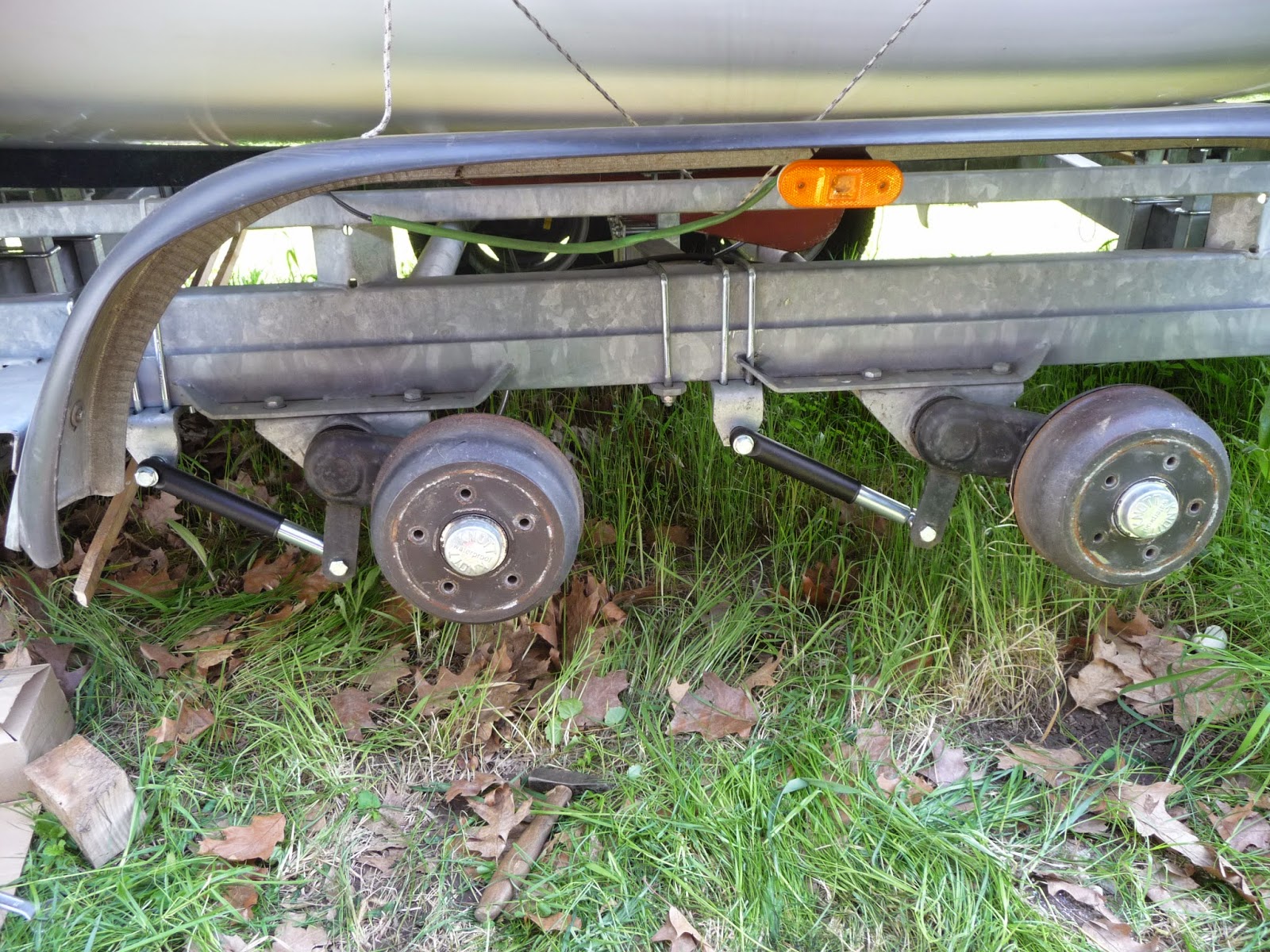 We sail Phobos 21 Adding shocks onto our trailer