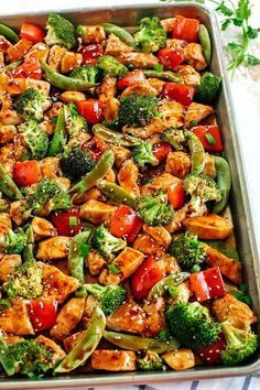 This Sheet Pan Sesame Chicken and Veggies makes the perfect weeknight dinner that’s healthy, delicious and easily made all on one pan in under 30 minutes!