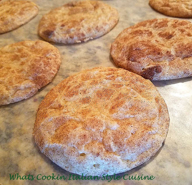 these are a cinnamon sugar cookie with a delicious outer crispy cinnamon coating baked on. This is how to make the best ever snicker doodle cookies. These cookies are on a pretty Christmas plate that says ho ho ho and Christmas santa cookie decorations are in the background,