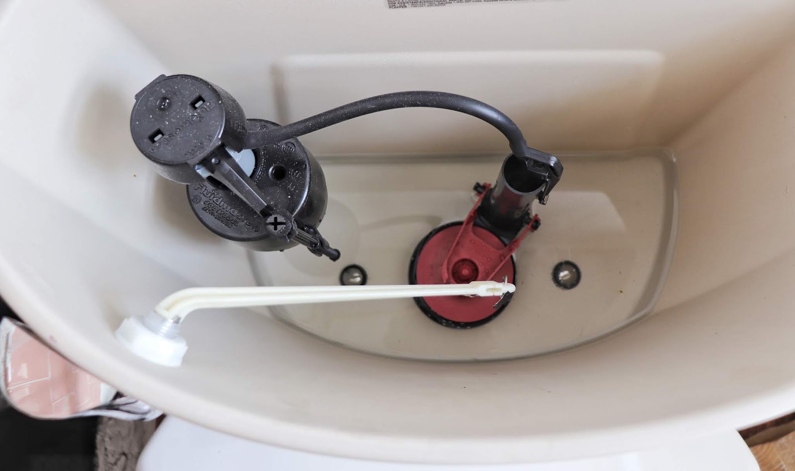 How to Replace a Toilet Flush Handle - Made by Carli