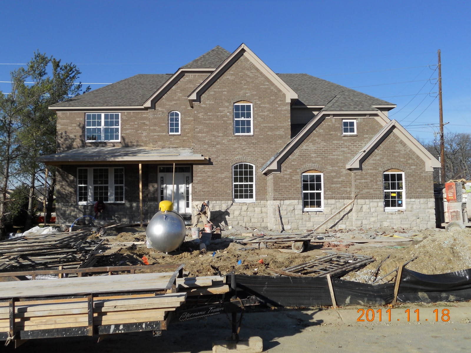 Brick work complete, stair railing installed and trim work in progress