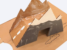 Paint and cover your cardboard bridge with Mod Podge 