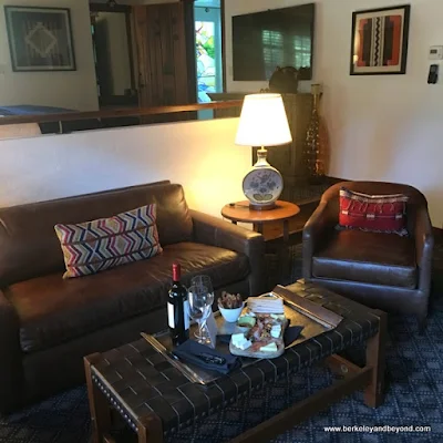 sitting area in guest room at Rancho Caymus Inn in Rutherford, California