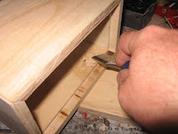 Use a wood chisel to remove any excess wood