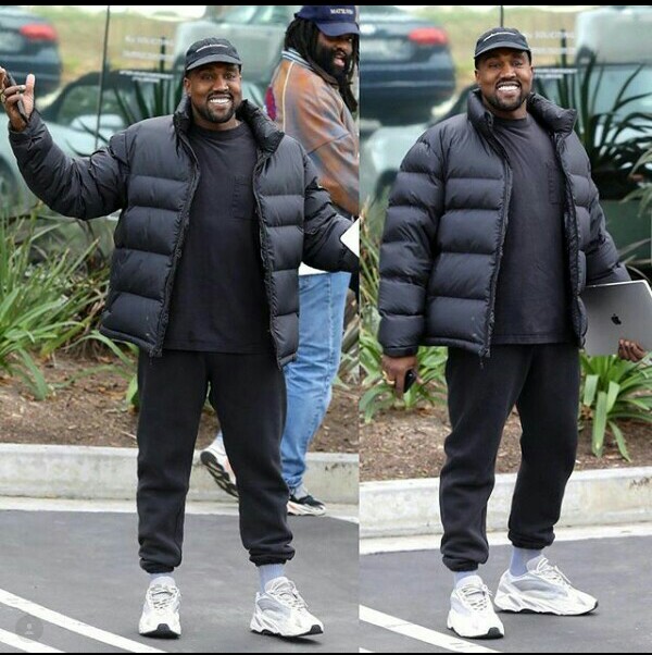 Kanye West smiles at the Paparazzi as they congratulate him on birth of ...