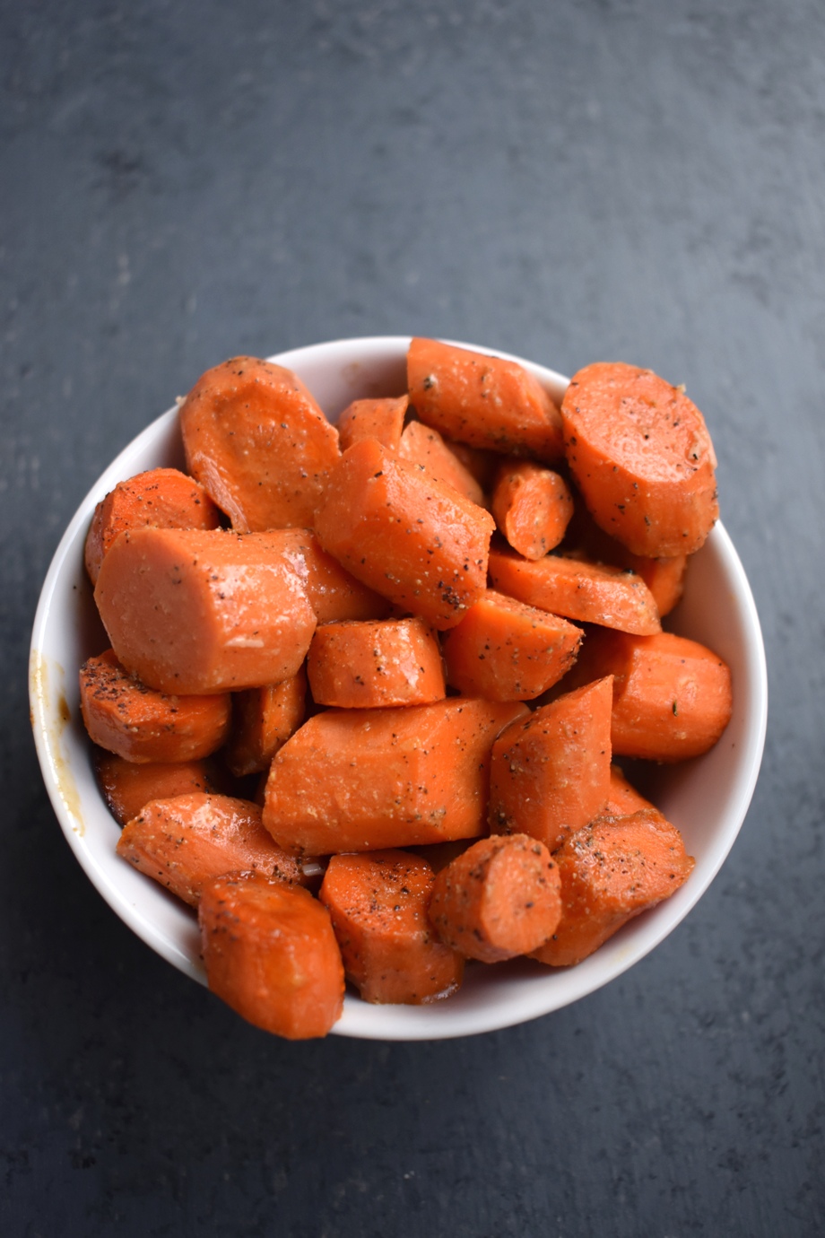 Dijon Roasted Carrots are loaded with flavor and roasted in the oven then topped with a tangy garlic dijon sauce!