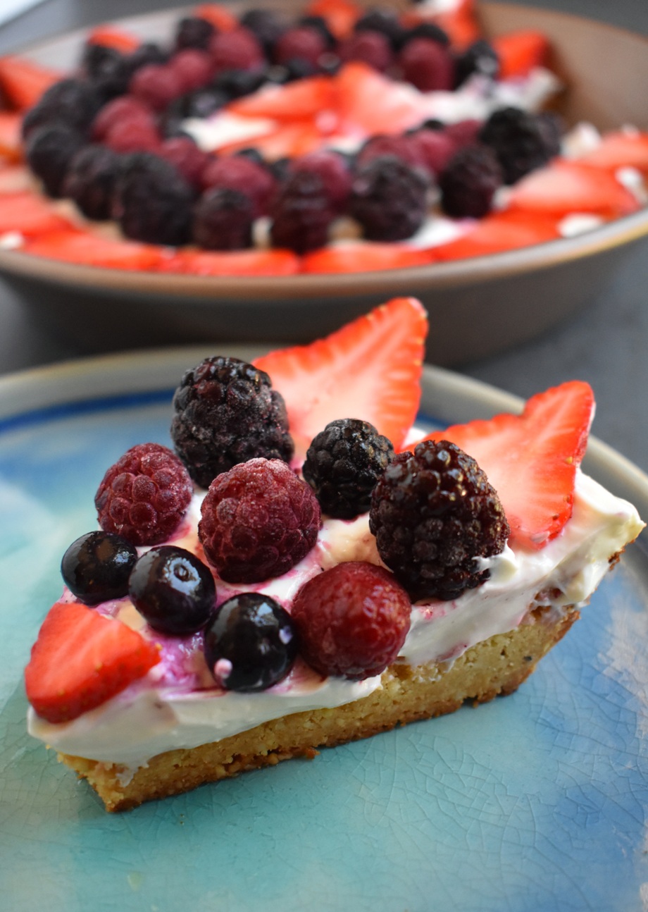 Berry Cheesecake Tart featured a creamy Greek yogurt cheesecake filling, a 3-ingredient almond crust and a variety of fresh berries for the perfect, healthier dessert ready in about 1/2 an hour! www.nutritionistreviews.com