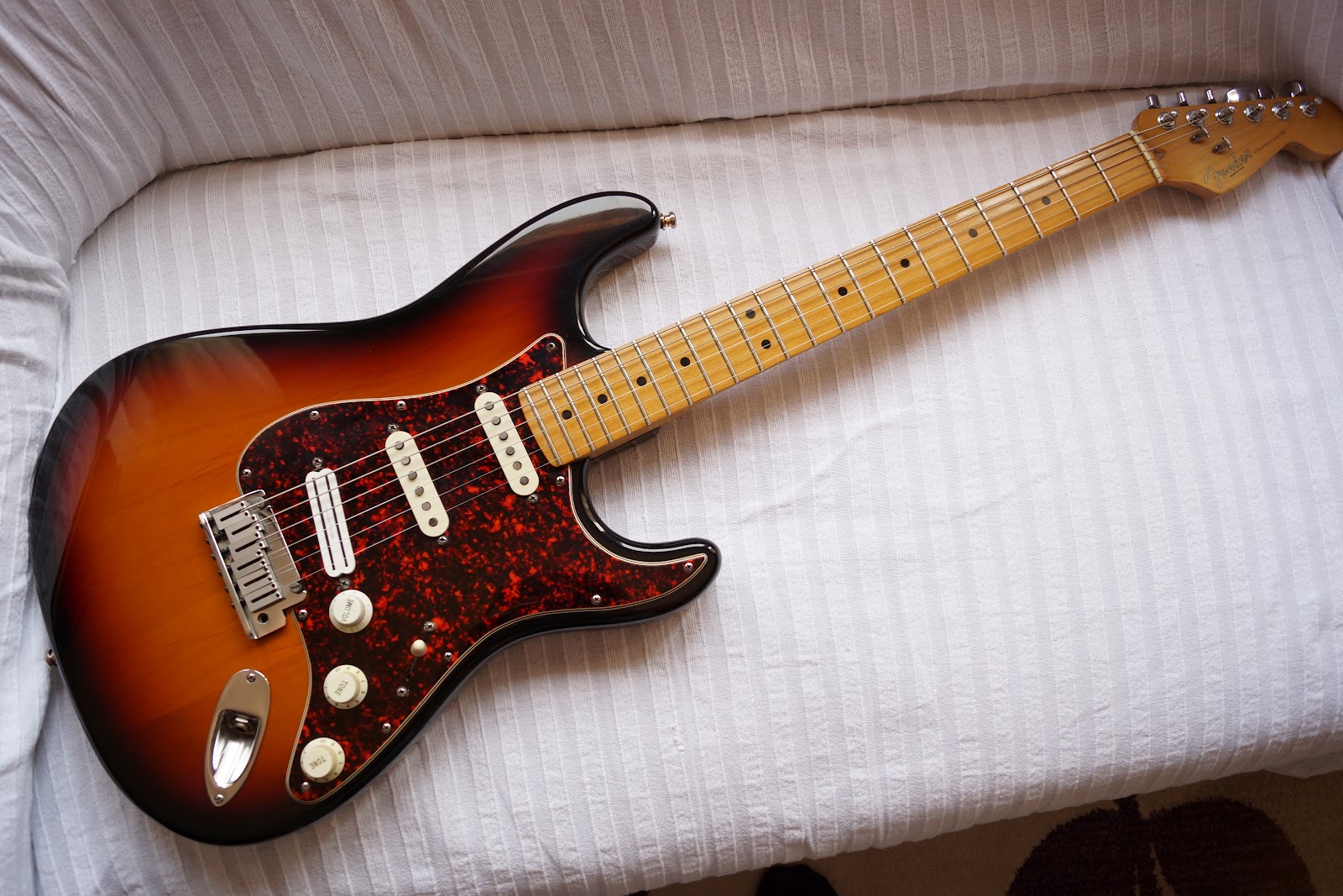 Just put a Hot Rails humbucker in the bridge pickup position. Much