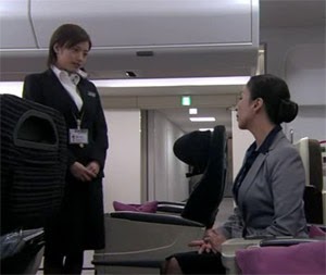 Misaki speaks with Mikami in the model cabin.