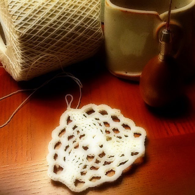 A white crochet lace motif