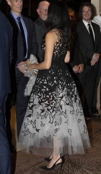 Meghan Markle wore Oscar de la Renta white tulle gown, tweed laser cut birds, from Pre-Fall 2018 collection. Aquazzura Deneuve pumps