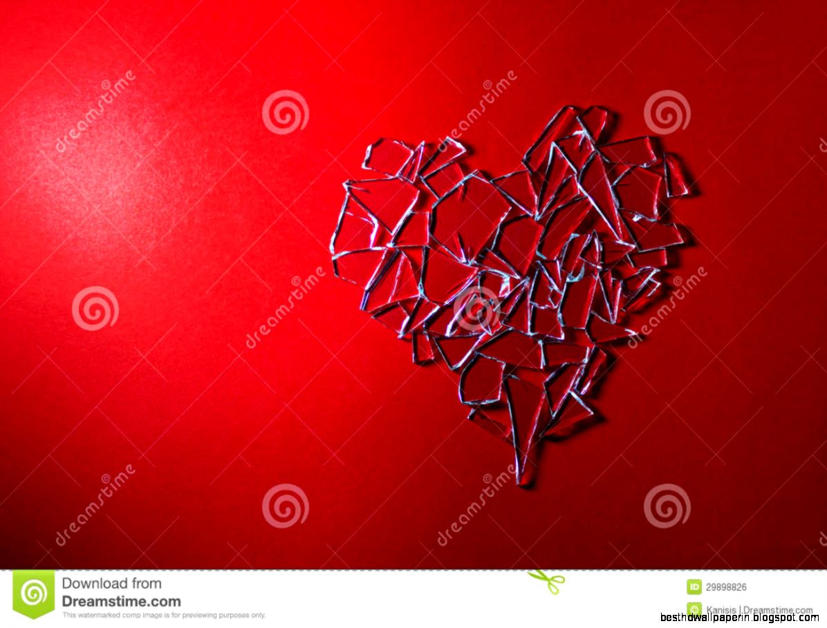 Broken Glass Heart On Red Background Royalty Free Stock Image