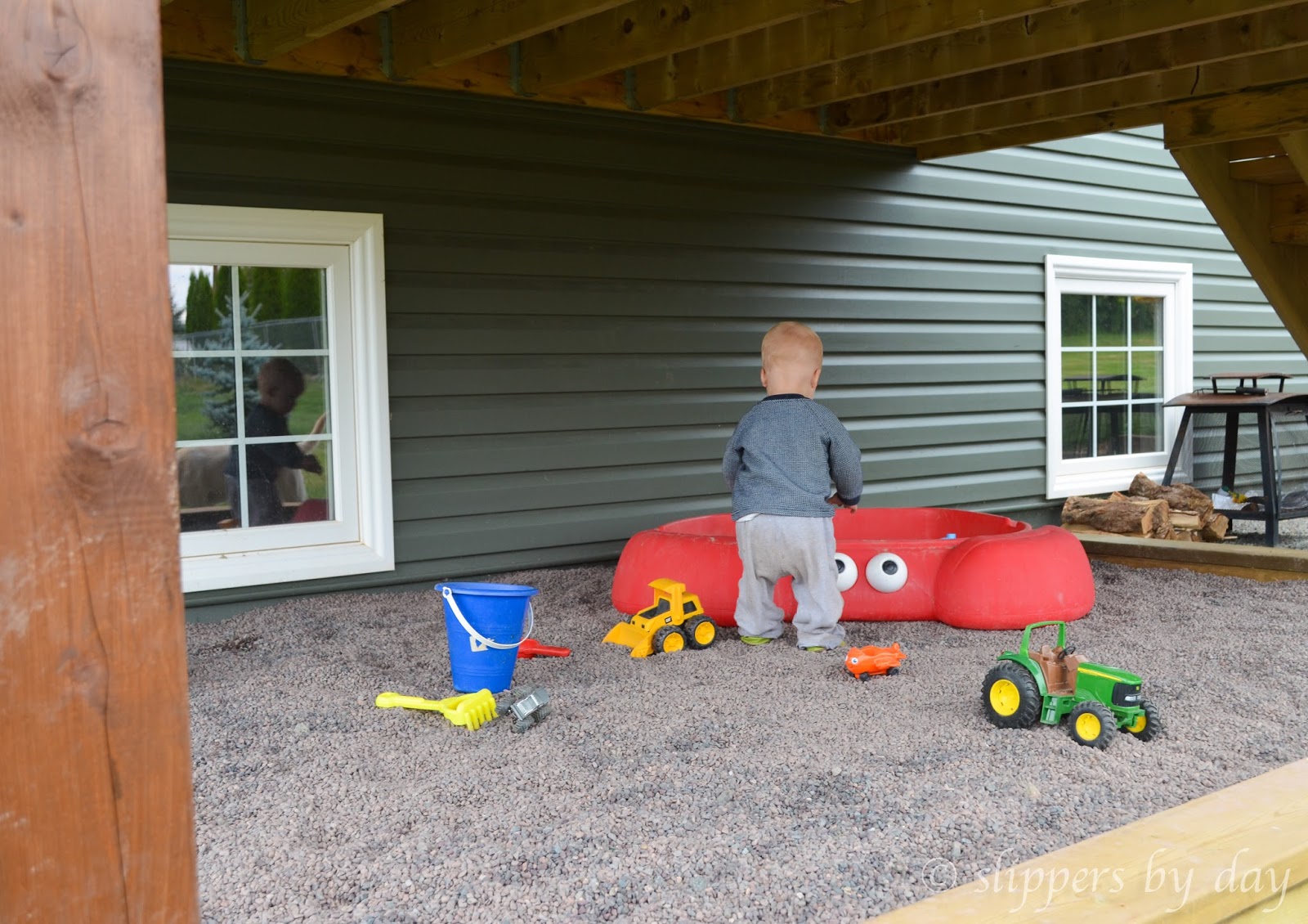 Slippers by Day DIY Sandbox Beneath a Raised Deck