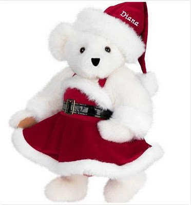 photo of white teddy bear in christmas dress