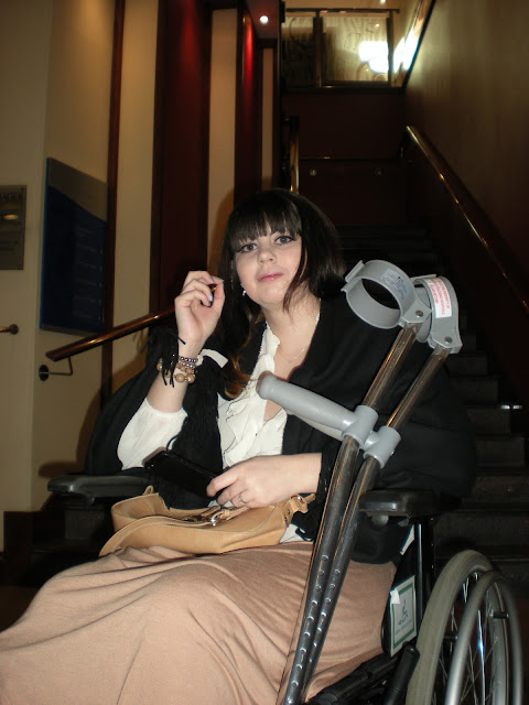 a girl in a wheelchair with cructhes