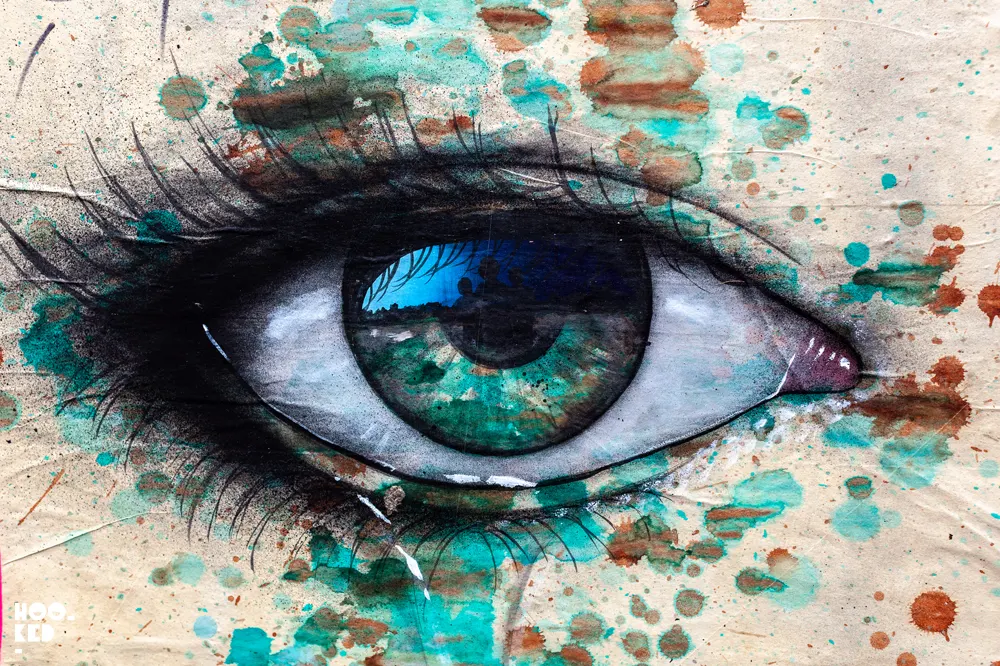 Street Artist My Dog Sighs paste-ups of a large eye jn London, UK