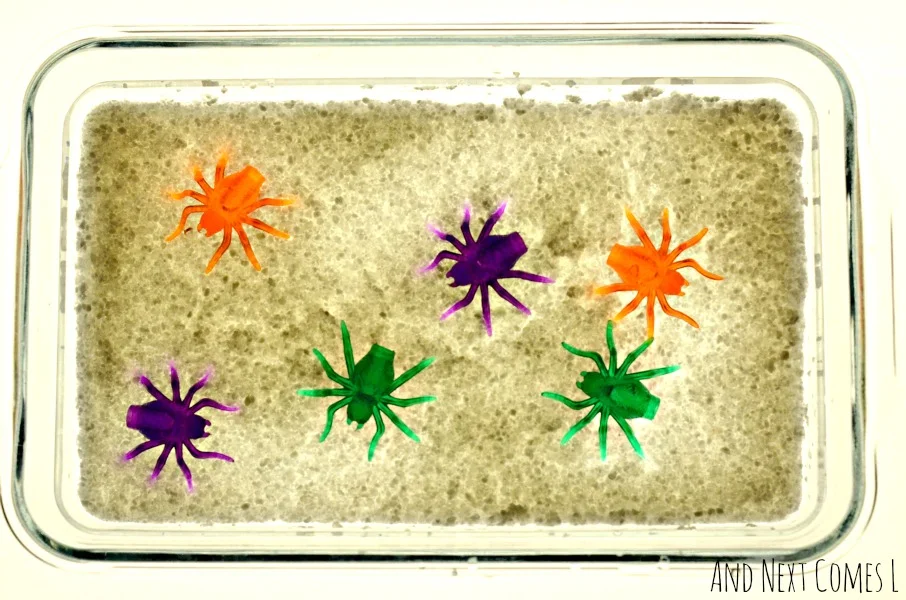 Spider sensory play on the light table for toddlers and preschoolers - great activity for Halloween from And Next Comes L