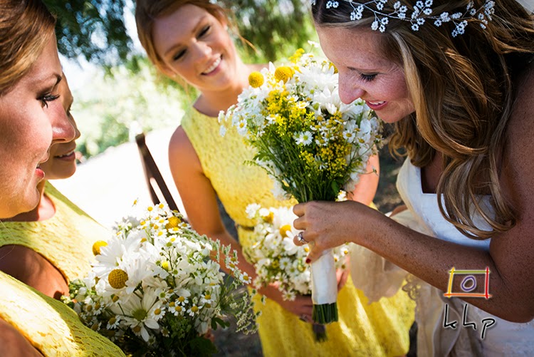 Kristyn shows of her ring to her bridesmaids in the lemon orchard at The Limoneira Ranch