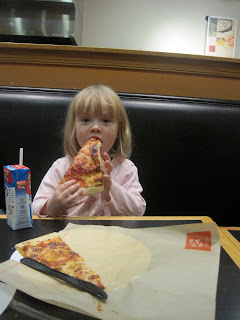 Small girl with slice of pizza 