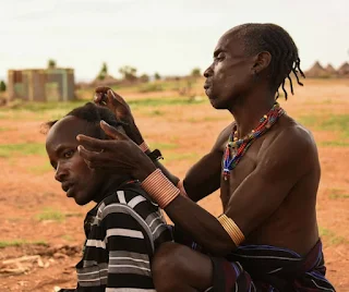Braiding hair Hamar Tribe Ethiopia