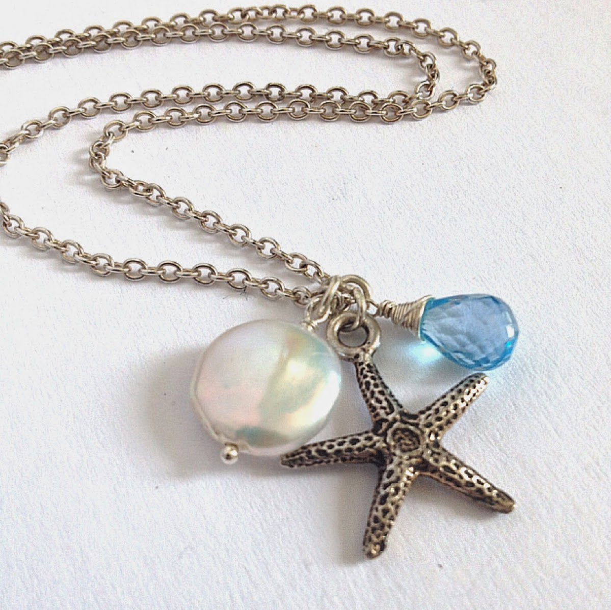 https://www.etsy.com/listing/188591663/starfish-pearl-swiss-blue-topaz-necklace