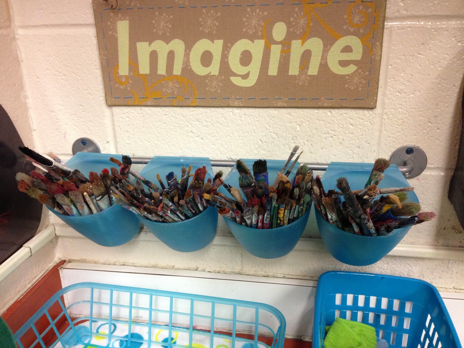 Use fun containers to hold brushes and other art supplies. Use fun containers to hold brushes and other art supplies.