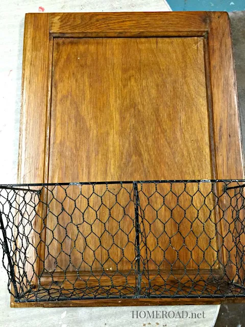 Vintage cabinet door with black wire basket