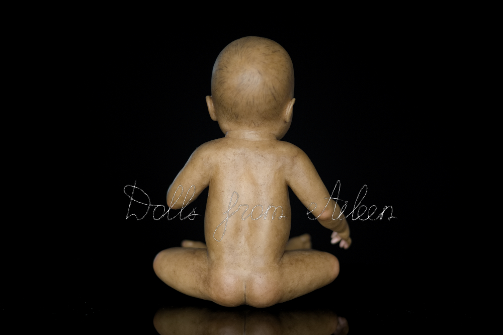 OOAK baby girl doll sitting, view from behind
