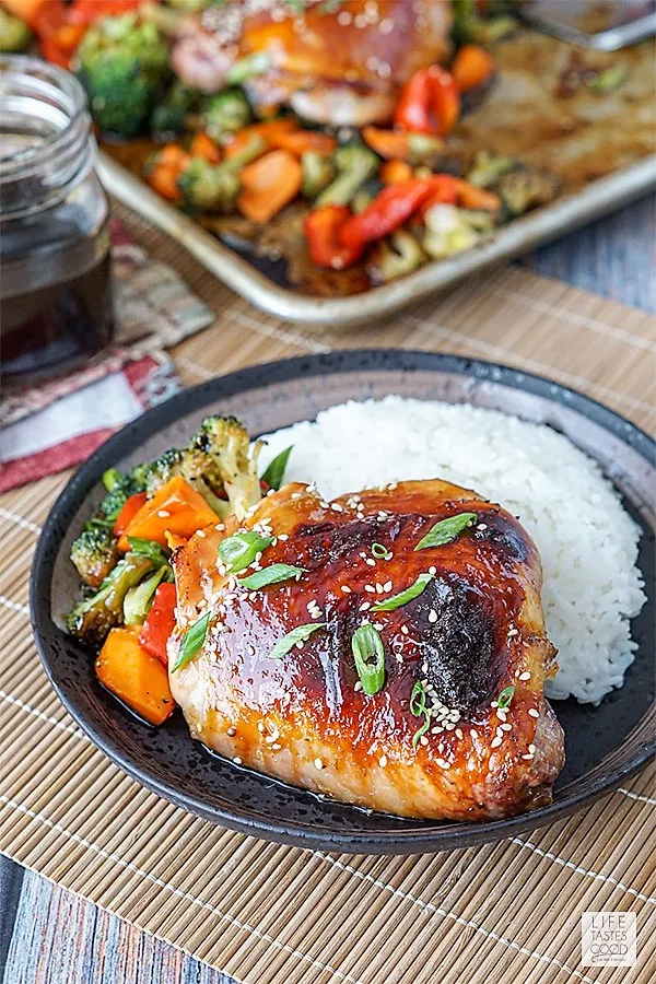 Baked Teriyaki Chicken Thigh with roasted vegetables and rice on a plate ready to eat