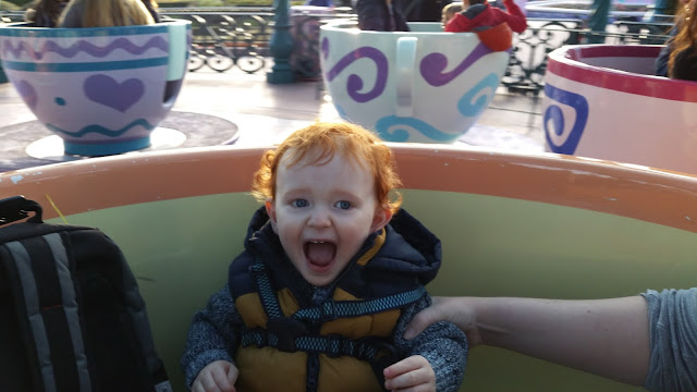 Toddler on the teacups at Disneyland Paris