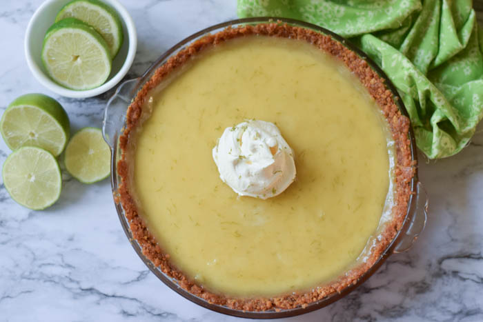 Key lime pie made with graham cracker crust and the most delicious and refreshing filling. Key Lime Pie is a perfect addition to any celebration! 
