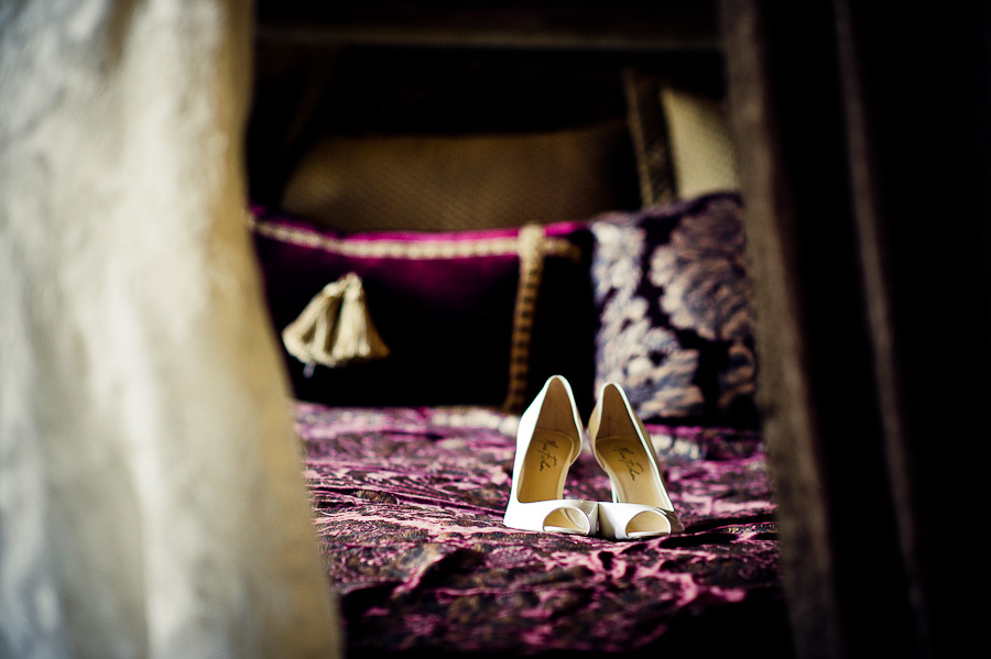 White Bridal shoes on the bed