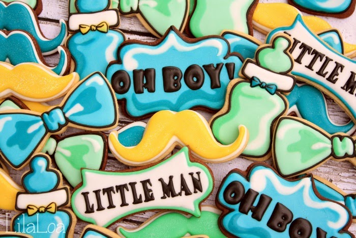 Decorated baby sugar cookies -- bowties, bottles, and mustaches