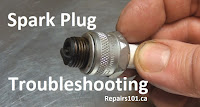 examining a fouled spark plug