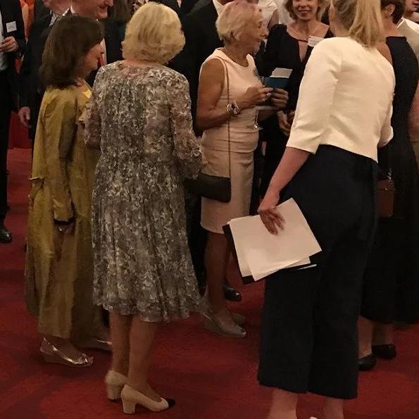 Duchess of Cornwall attended a reception at Buckingham Palace to mark the 50th Anniversary of the Man Booker Prize. Duchess wore print summer dress