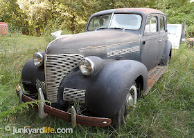 Classic 1939 Chevy behind barn in Tennessee, original with 590 miles on odometer.